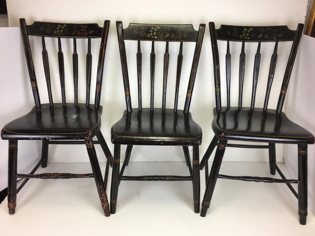 3 arrow back stenciled chairs: painted black, thumb back, 4 arrow backs, 16 1/2" h to seat, 31" h to back of chair, one has paint loss and is in fair condition
