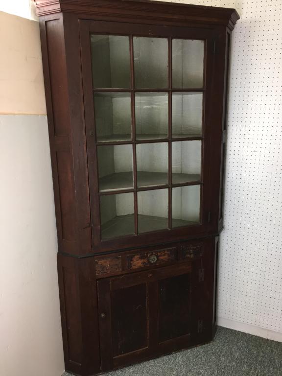19th c Pine Corner Cabinet: 2 sectional, 12 early paned glass top cupboard, with plate rails, one center drawer with 2 false side front drawers, lower cupboard has one shelf, paneled, top section is 34 1/2" x 5 3'4" deep and low