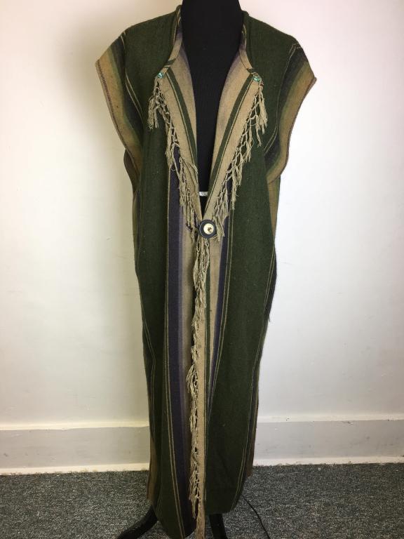 Vintage Karen Wilkinson Long Vest: blanket style, label reads "Karen Wilkinson Collection Santa Fe," wool, fringe accent, turquoise stone buttons on lapel, wooden button closure at waist, side split with 3 velvet accents, 21" width x 4