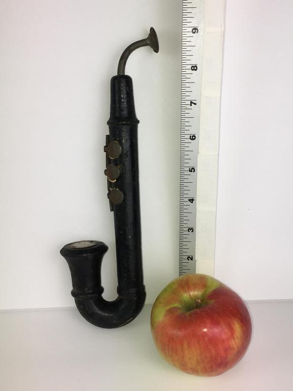 Salesman Sample Saxophone: wooden, made in Czechoslovakia, tin mouthpiece, tin frets, 9" l damage on bottom on one side, minor scratching