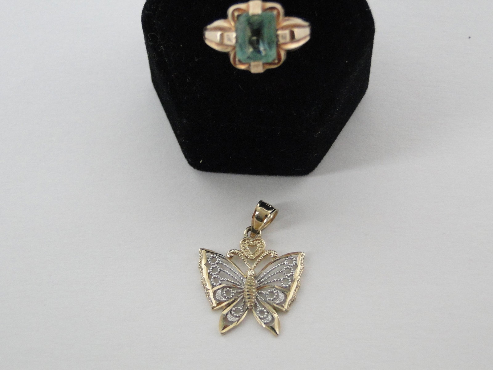 10 KT Gold Pendant & Ring: two tone 10KT butterfly pendant 1 3/4" and 10 KT yellow gold ring with worn and abraded aquamarine stone, 3 corners are chipped, size 6