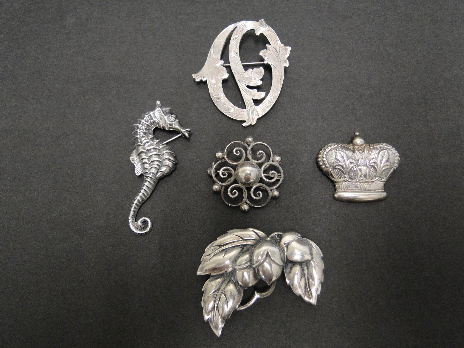5 Sterling Pins: Beau Seahorse, 2 1/2"; Denmark H.S. circle pin 1 1/2"; Viking Craft acorn and leaf 2" pin; crown pin, 1 1/2"