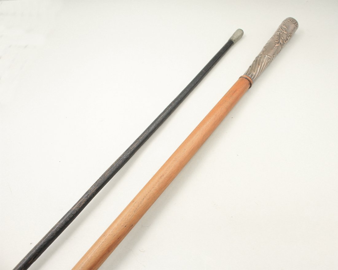 Walking stick with a silver head decorated (1 of 2)