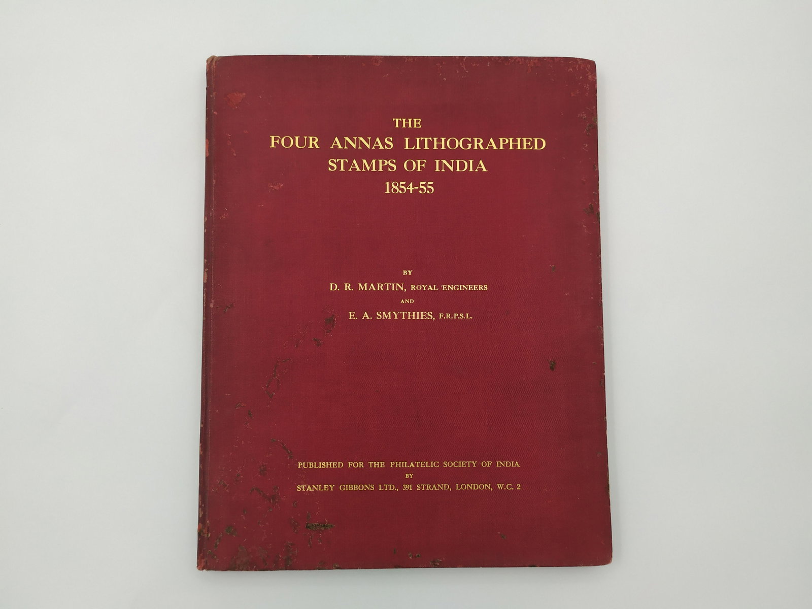Book 'The Four Annas Lithographed Stamps of India: Book 'The Four Annas Lithographed Stamps of India 1854-1855', 1930, 49 pages. Includes 12 attached panels. marks on cover. The stamps reviewed by the book are considered extremely rare and are highly 