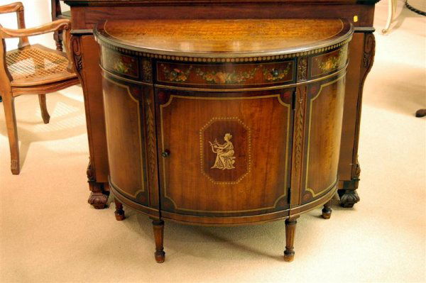 SATINWOOD DEMILUNE COMMODE: EARLY 20TH CENTURY SATINWOOD DEMILUNE COMMODE; BY IMPERIAL, ADAMS STYLE WITH FLORAL & FIGURE HAND PAINTED DECORATIONS, BLUE PAINTED INTERIOR, 1 DOOR, 1 DRAWER - 32 1/4" HIGH, 36" WIDE, 16 1/2" DEEP