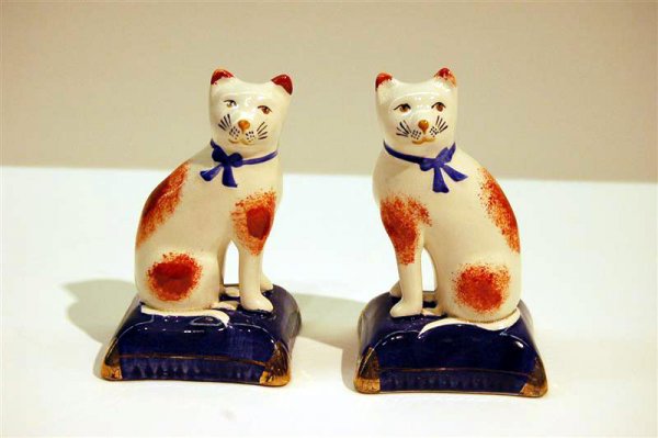 PAIR OF MODERN STAFFORDSHIRE FIGURES - CATS ON PILL