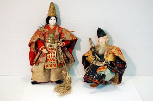 TWO ORIENTAL FIGURES WITH SILK CLOTHING - 6" & 8 1/