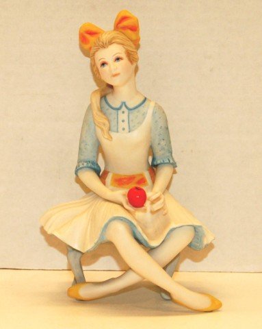 Cybis Figurine - Seated Lady Holding Apple: Cybis Figurine - Seated Lady Holding Apple - 8" tall