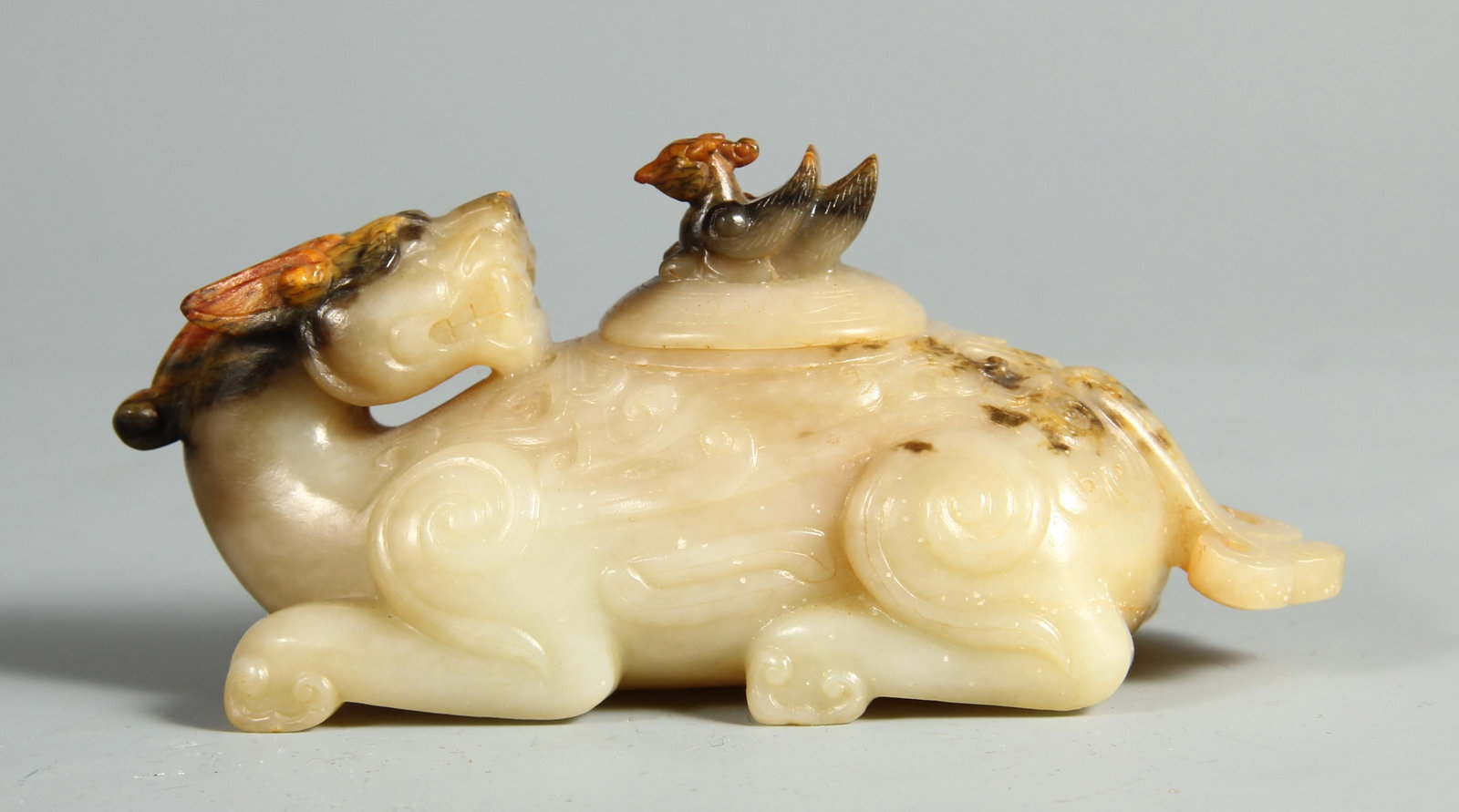 A CHINESE BEASTS DESIGN JADE INCENSE BURNER WITH COVER: L. 12 cm. W. 4.8 cm. H. 5 cm. Weight 270 gram.