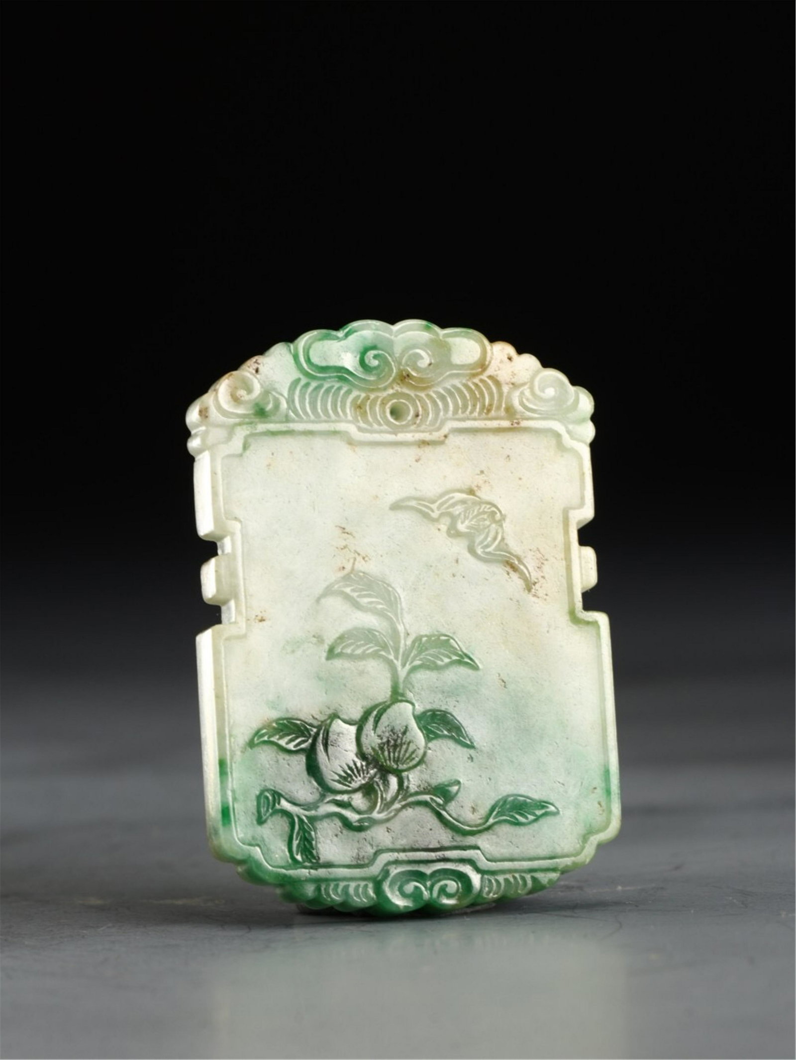 A CARVED BAT AND PEACHES JADEITE PLAQUE PENDANT: 5.5x3.8x0.6 cm. Weight 38 gram.