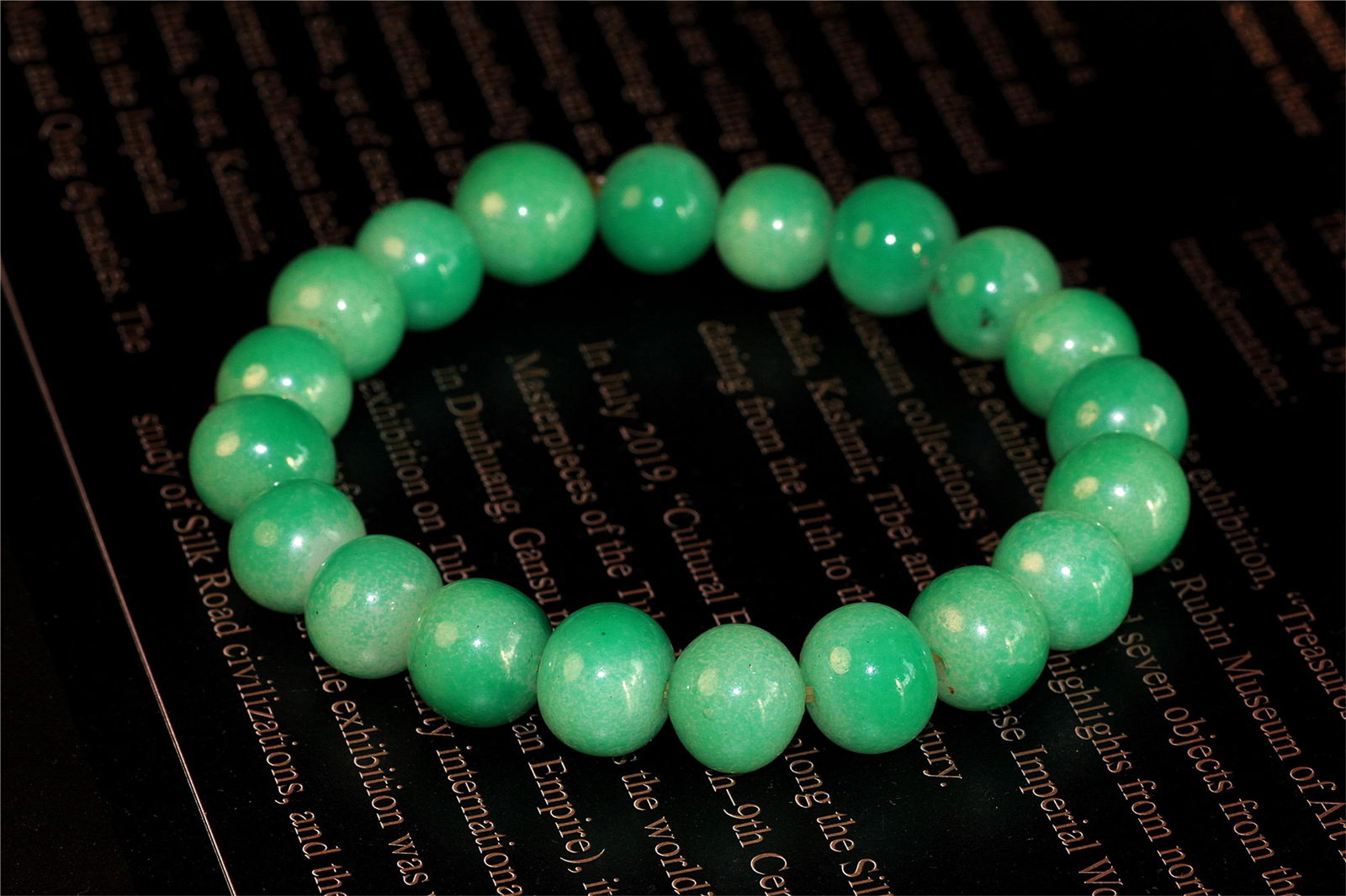 A Chinese Carved Jadeite Bracelet: Diam. 1.2cm