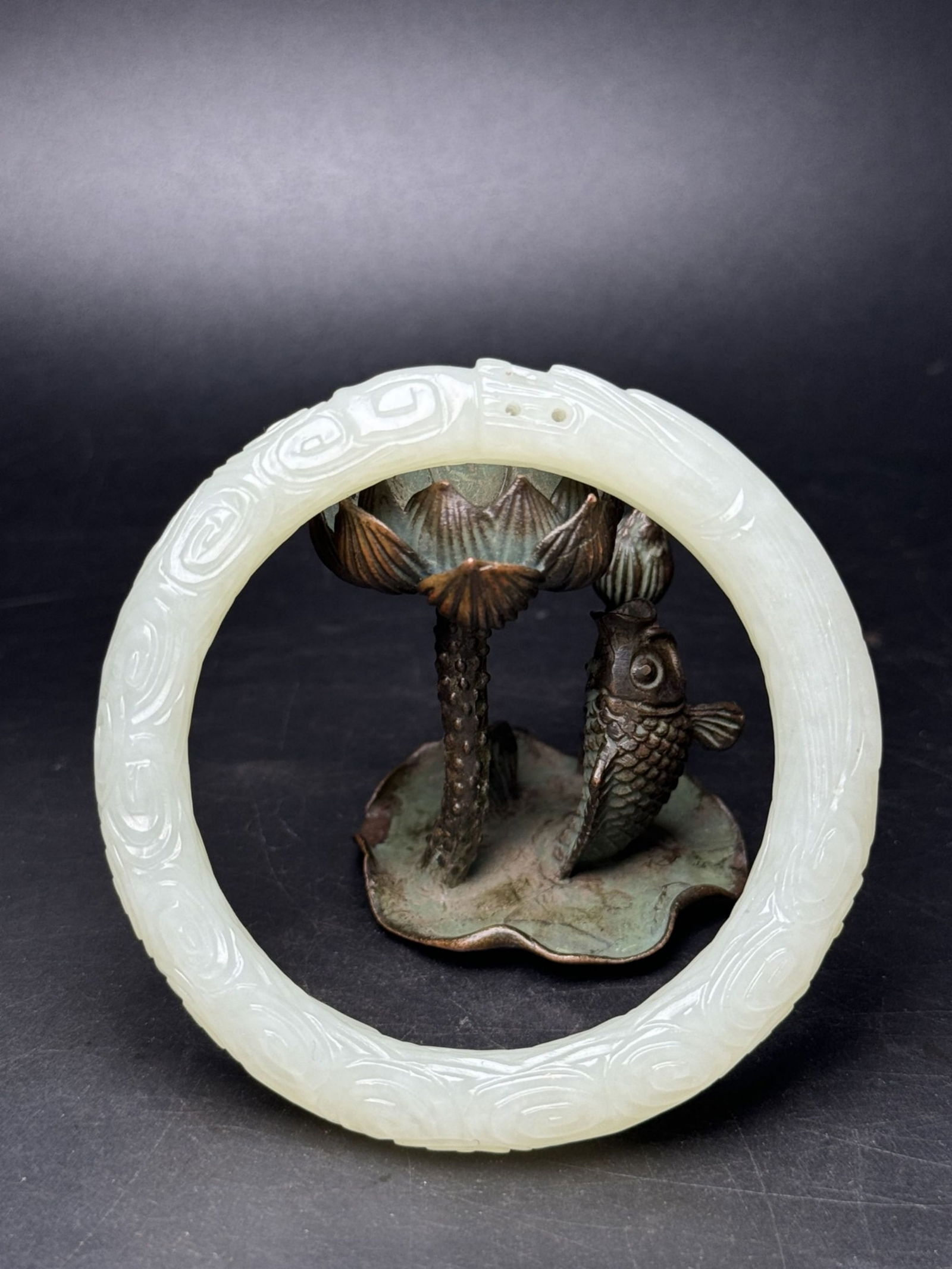 A Chinese Carved Jade Bangle: Wd. 5.5cm, Wd. 7.2cm, Wt. 41g