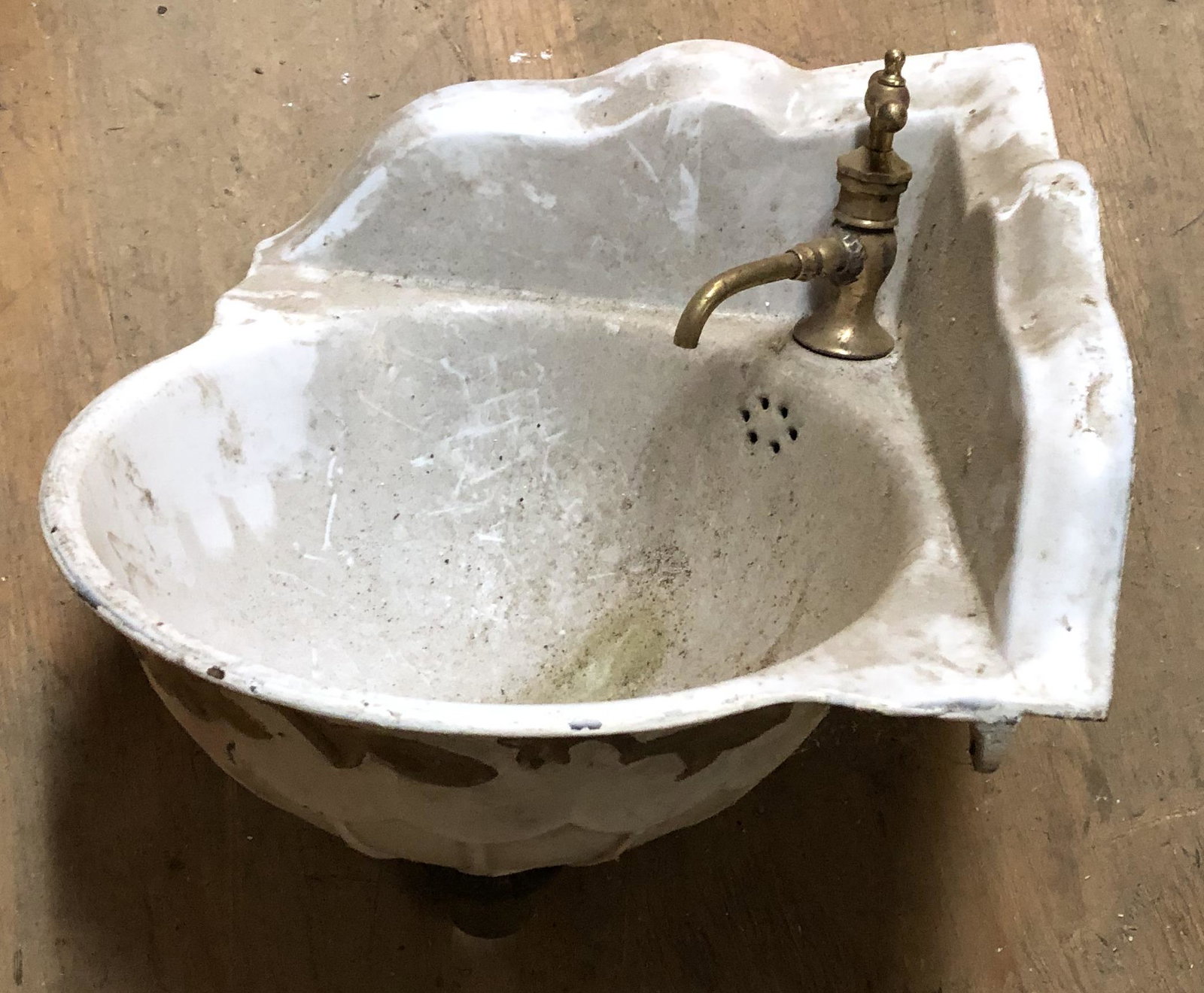Enameled fancy RR cast iron Corner sink: Cast Iron with fancy work and what appears to be the original faucet