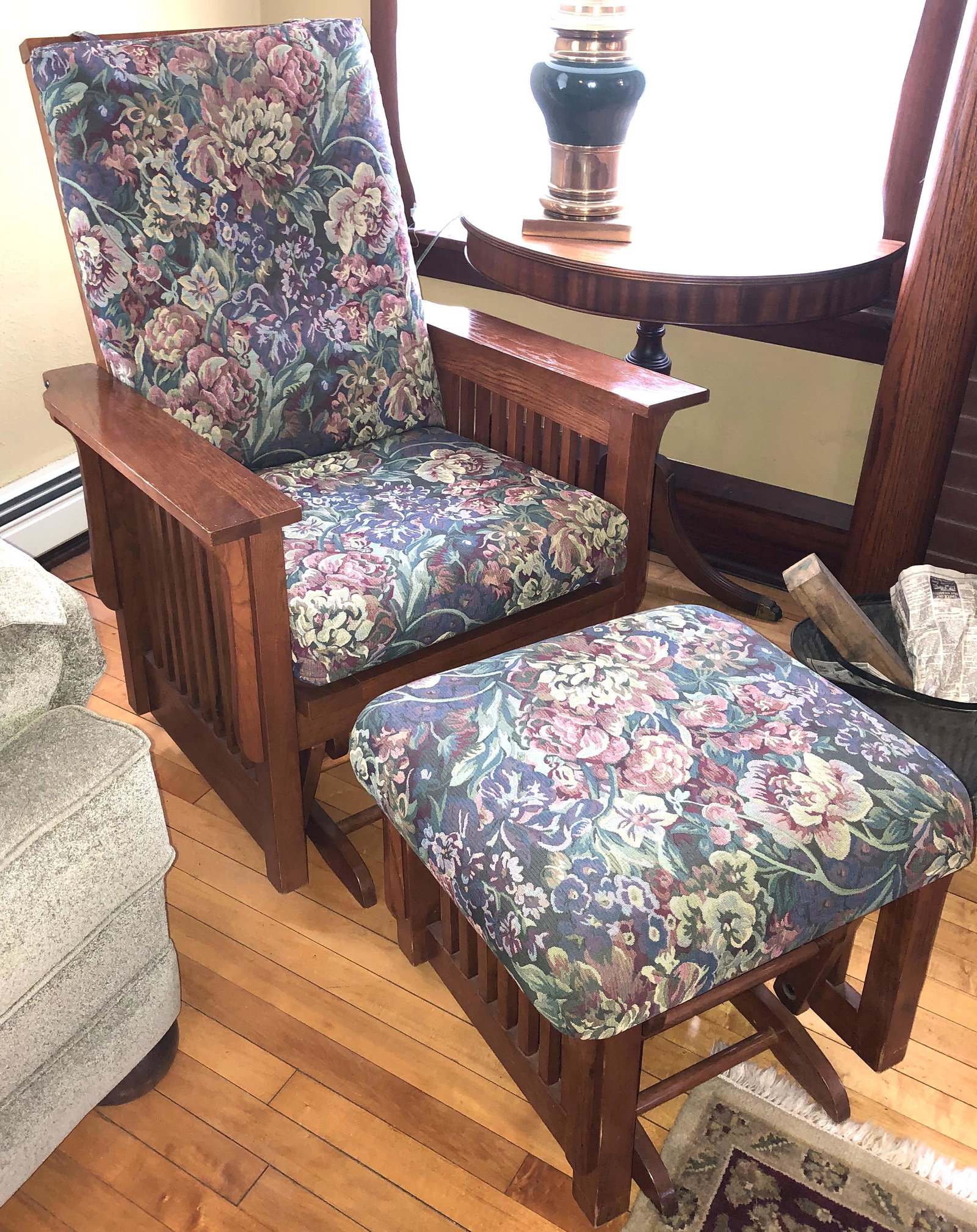 Arts & Crafts style gliding rocker & ottoman: Made of oak & upholstered in a very strong fabric. The back cussion snaps to the back of the chair so it can be removed easily. Both the chair & ottoman glide.