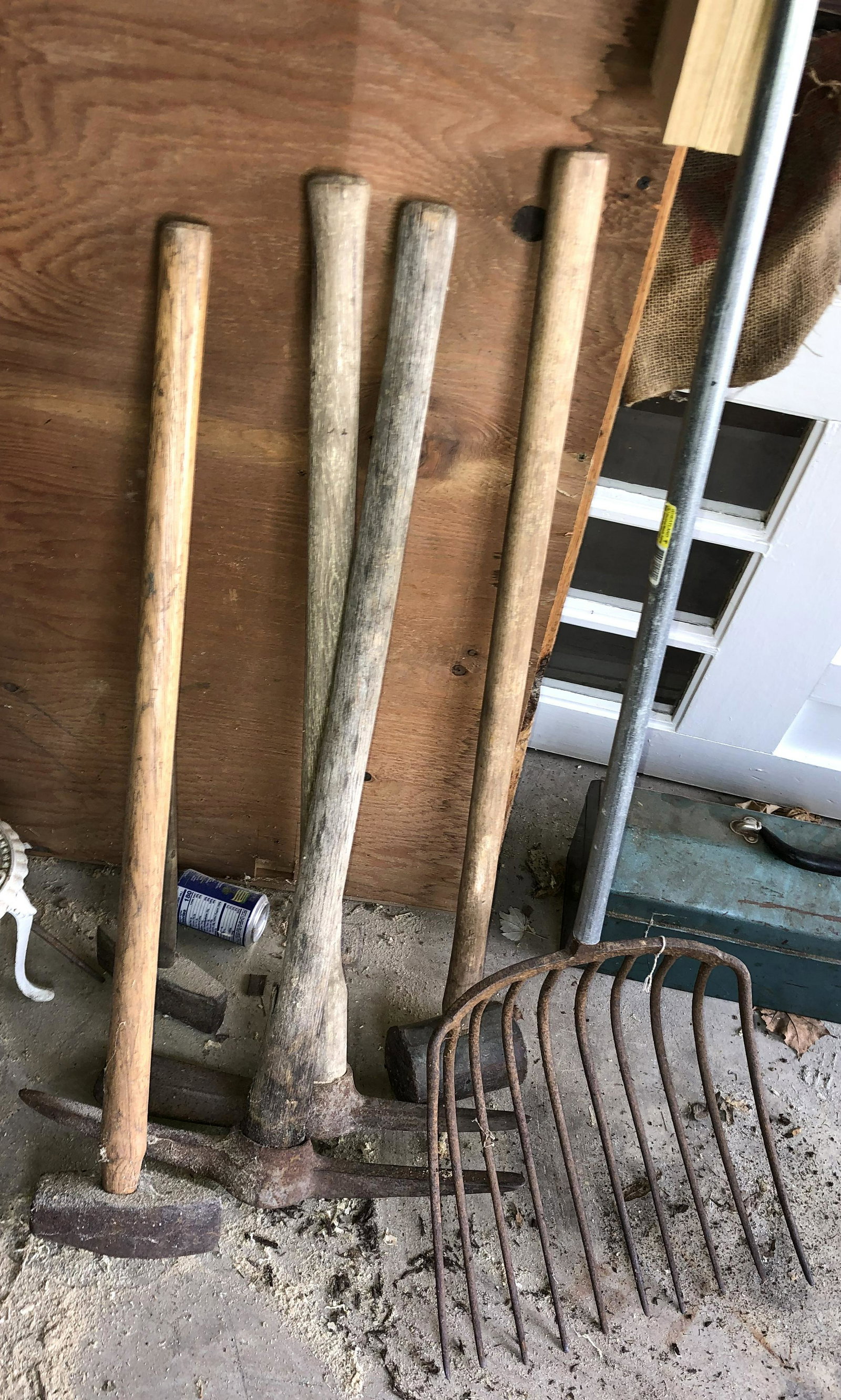 Group of yard tools: sledge, pitch fork, picks etc..