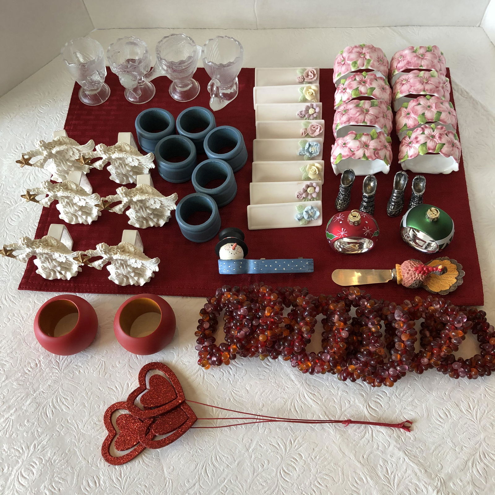 Group of table dressing: Napkin rings, card holders, candle holders etc