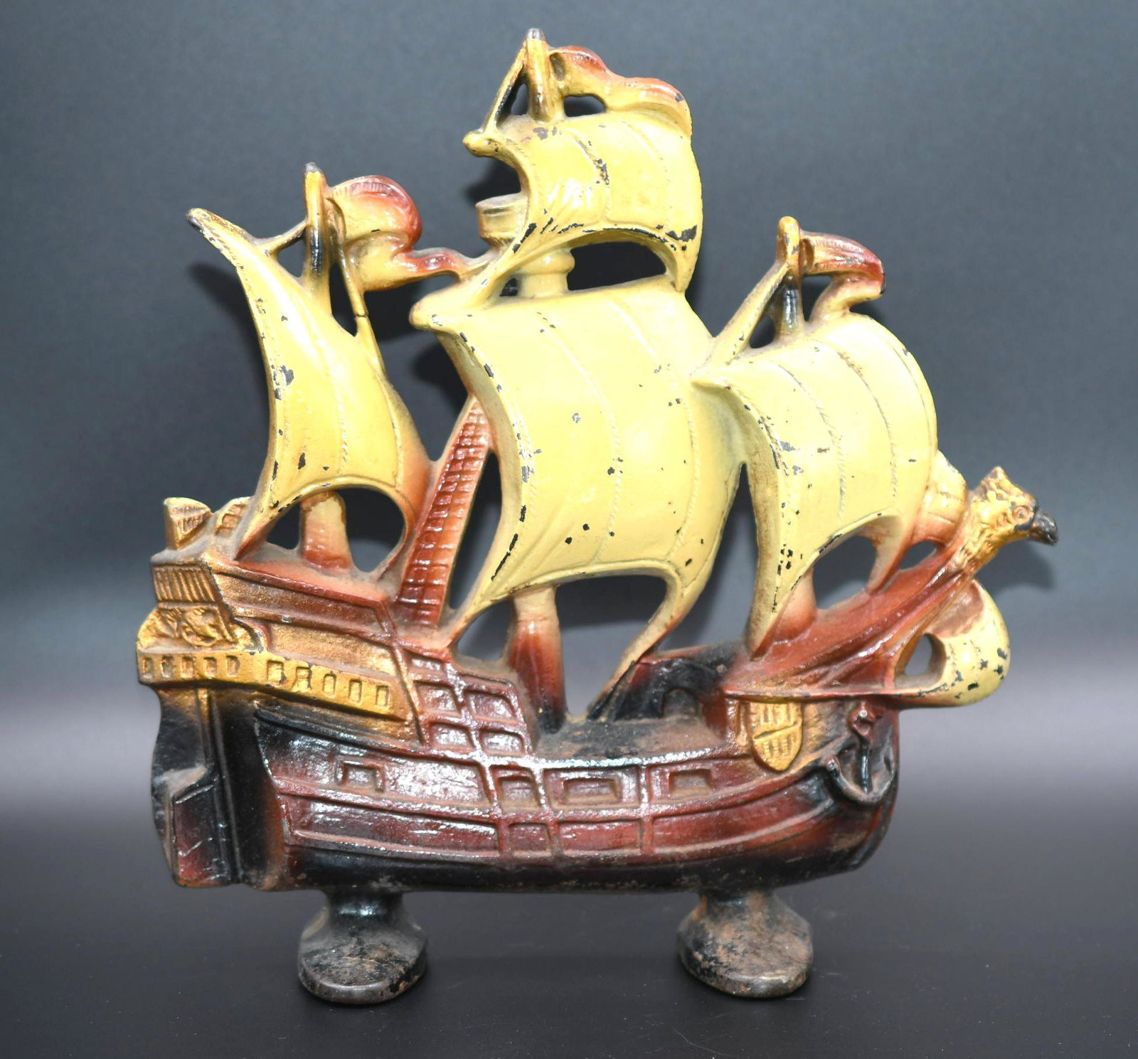 Vintage Castiron Ship Door Stop: Vintage cast iron with copyright of 1930 stamped on back as well as copyright Creation. It measures 11-1/2" tall x 11-1/2" wide and weighs