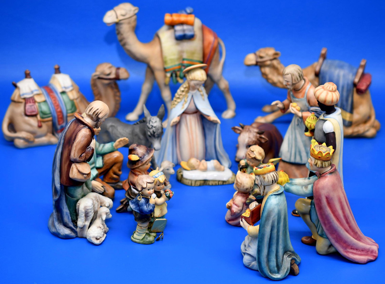 Hummel 18 piece Nativity Group: Standing Camel is 8-1/4" tall, Lying camel is 8-3/4" long, kneeling Camel is 5-1/2" tall, Cow is 6-1/8" long, Donky is 4-3/4" tall, sheep is about 2-5/8" long, Shepard with sheep is 6-3/4" tall, Baby 