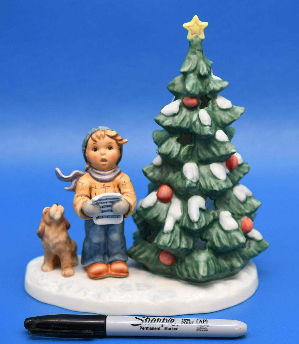 Hummel "Oh Tannenbaum": Original Hummel Holds a candle inside the tree, measures 7-1/2" tall x 6-3/8" wide, and weighs 1 lb