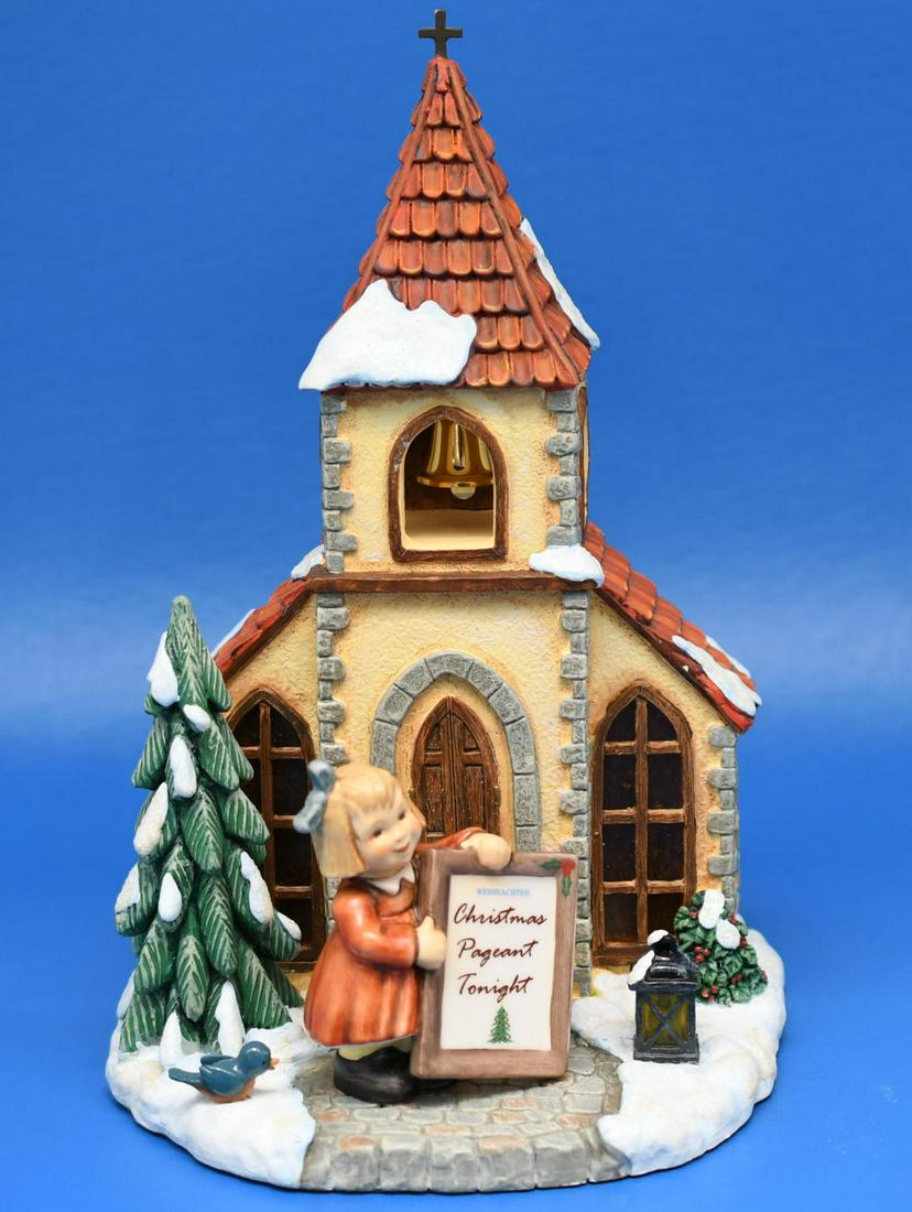 Hummel "Caroling Chapel": No 1143-D 2008 resin chapel 10" tall x 6-1/2" wide, with light up lantern & windows that require 3 AAA Batteries not included, also included is a 3-1/4" Hummel figurine no 2217-A. Combined weight is 2