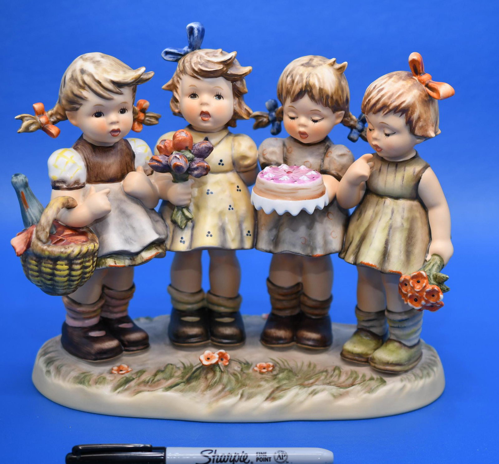 Hummel "We Wish You The Best": 1991 Century Collection No. 600, measures 8-1/4" tall x 9-1/2" wide, and weighs 2 lbs 12 oz