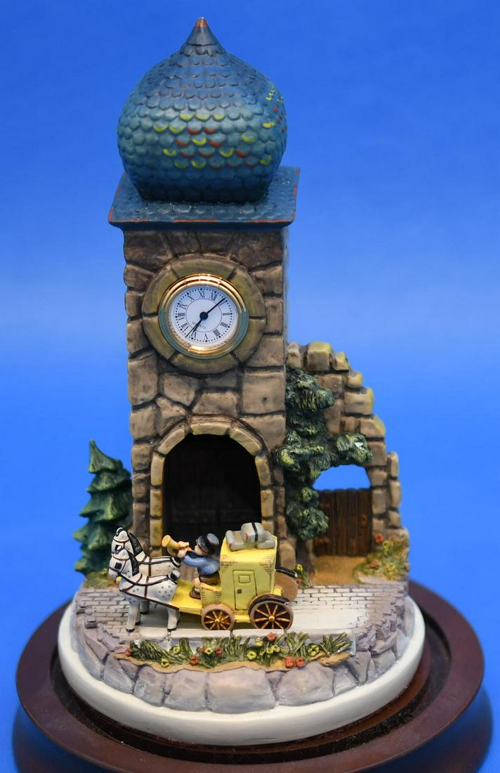 Hummel"The Mail is Here Clock Tower": Resin Quartz Clock Tower with Goebel Miniatures 1993 1st year of issue carriage on wood base in glass globe( has 3-1/4" crack in globe) total height 7-1/2" x 4-1/2" diameter, weighs 1lb 13oz
