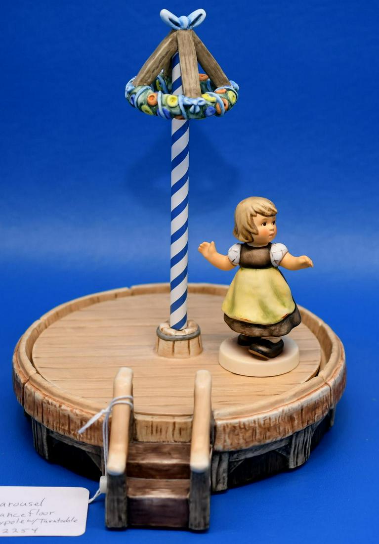 Hummel" Carousel Dancefloor" "Spring waltz": Carousel #22254 7-1/2" diameter ceramic with battery operated mechanism requires 3 AAA batteries not included, included is 3-3/4" hummel club 2007/2008 #912B figurine, weighs 2lb 7oz