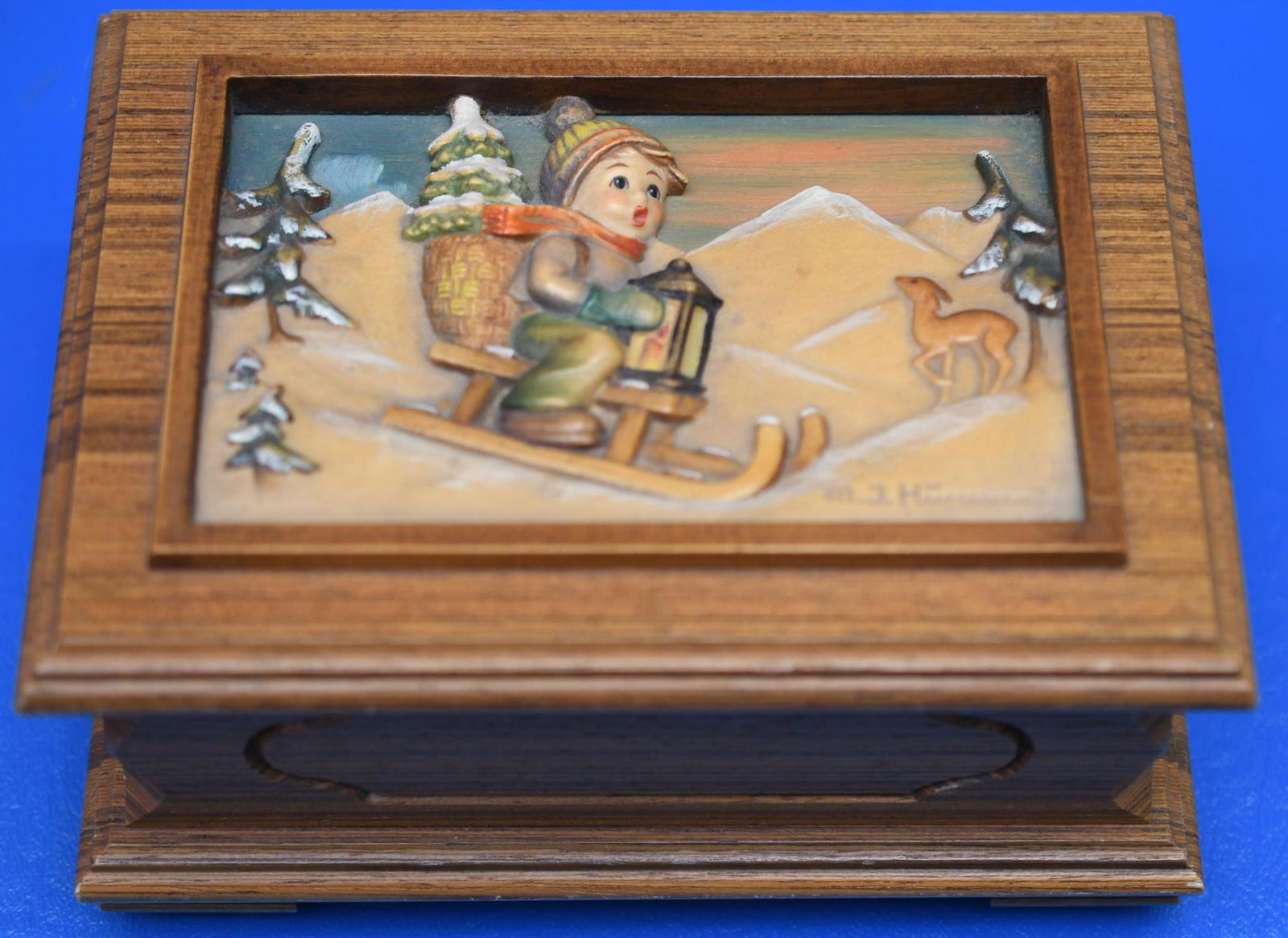 Goebel Hummel "Anri" Four Seasons Series Swiss Music: Anri made this wonderful wood body 1986 First Edition in a series of Four Italian Music Box that plays "Winter Wonderland" this is No. 06219 of 10,000 of a limited edition. Measures 6" x 4-1/2" x 3" h