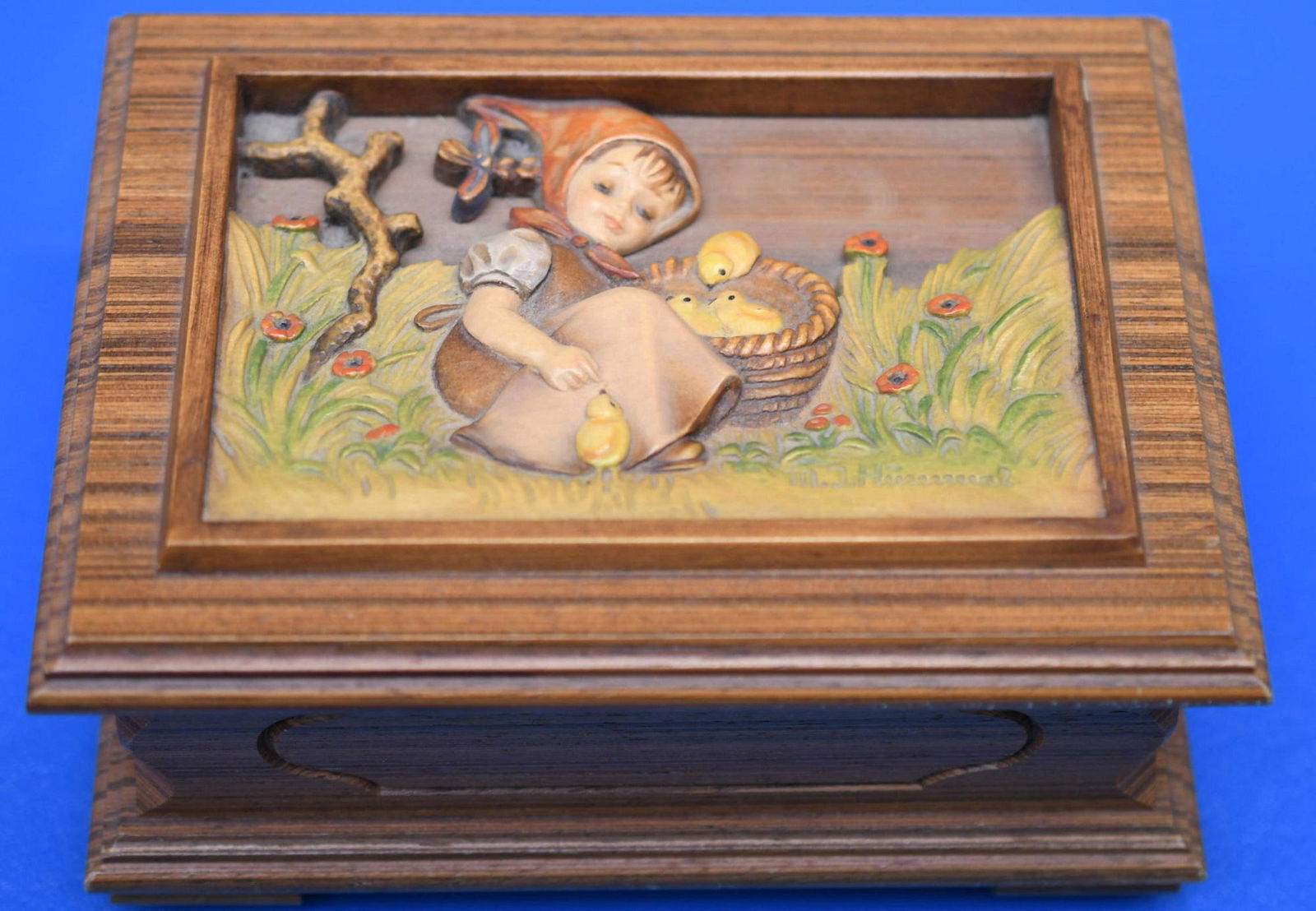 Goebel Hummel "Anri"Four Seasons Series Swiss Music Box: Anri made this wonderful wood body 1987 Second Edition in a series of Four Italian Music Box that plays "Voices Of Spring" this is No. 01313 of 10,000 of a limited edition. Measures 6" x 4-1/2" x 3" h