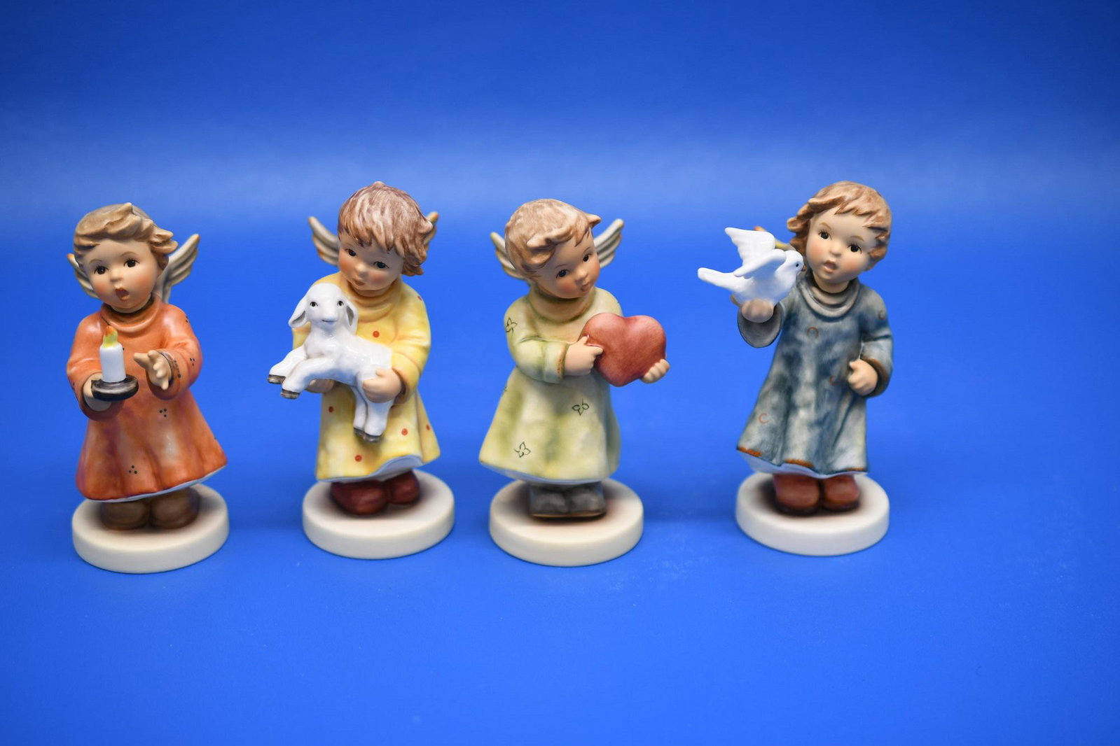 Hummel's "4 Annual Angels": Left to right 2011 "Angel Of Hope", 2012 "Angel Of Comfort", 2013 "All Yours", 2010 "Angel Of Peace. Combined Weight of 1 lb