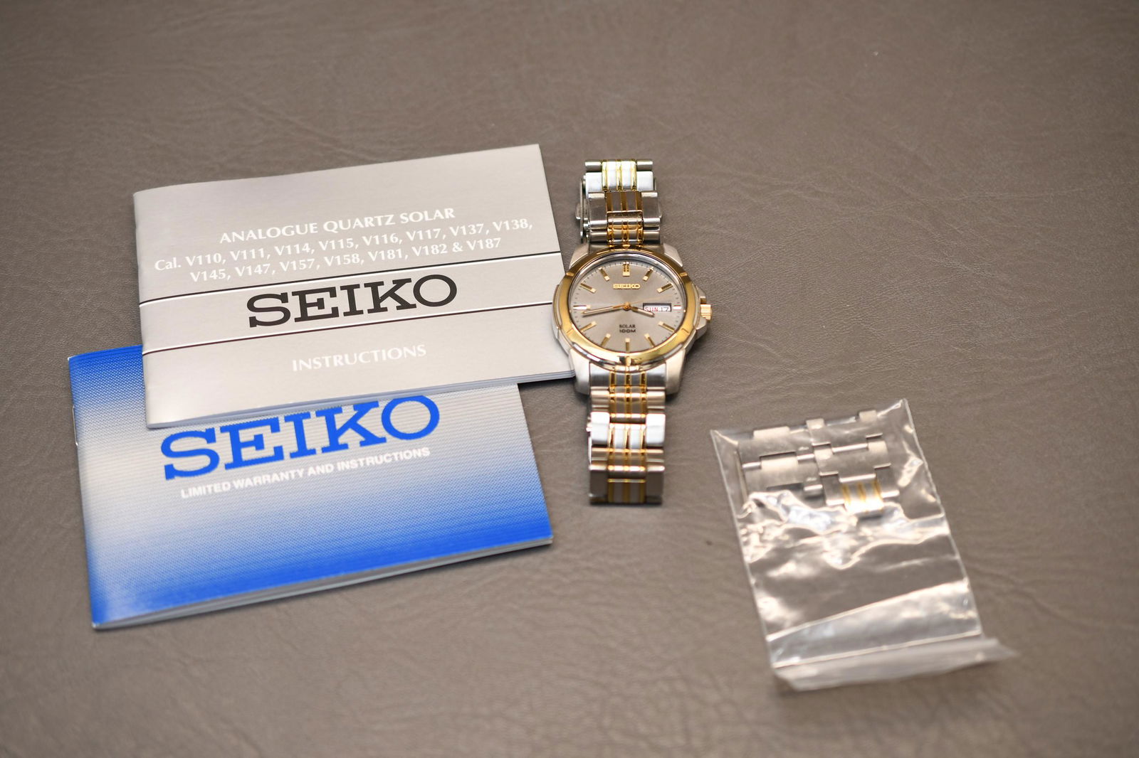 Seiko Solar Men's Wrist Watch: working, 100 Meter water resistance, stainless steel, solar powered, has been sized, approximate weight 6.5oz