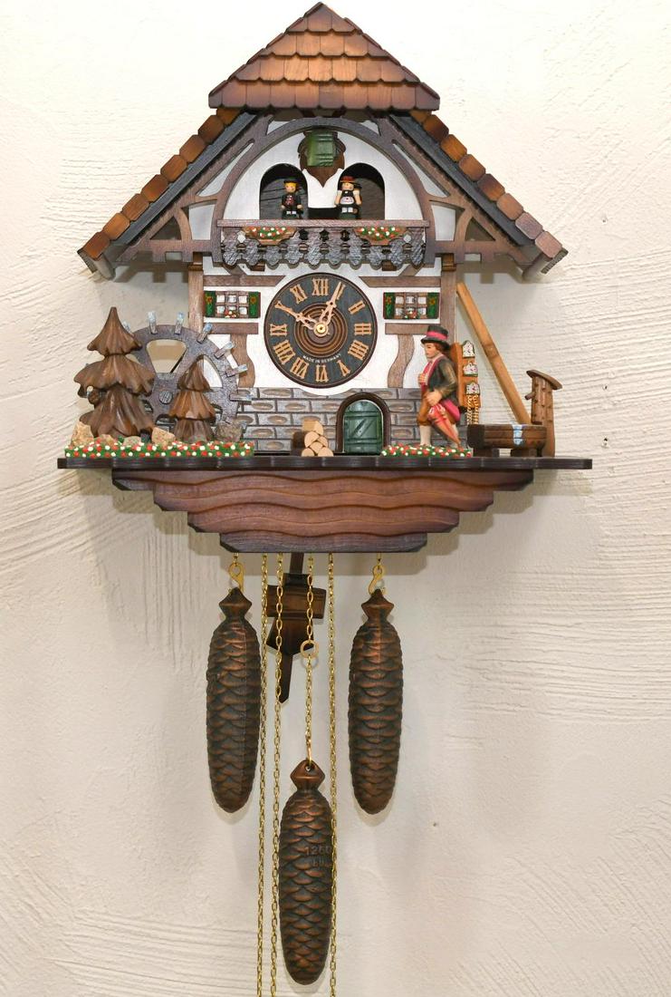 German Cuckoo Clock, Edelweiss Swiss Musical Movement: In working Condition, 1 shingle is chipped on gable (see photo), right foot on man is starting to split(see photo), House is 17-1/4" tall x 15-3/4" wide, approximate weight 15lbs