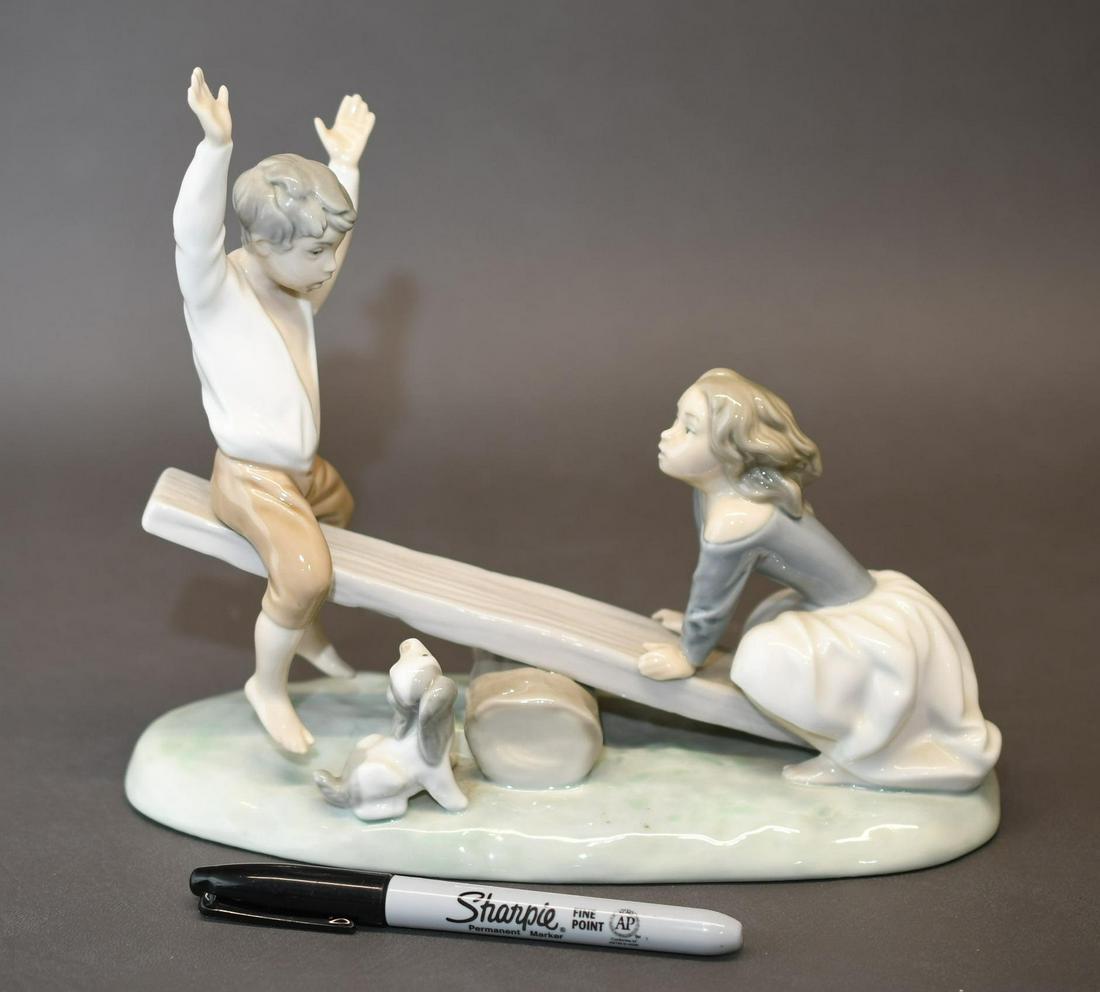 Lladro Children playing see-saw: 9-1/4" long x 8" high approximate weight 2lb 7oz