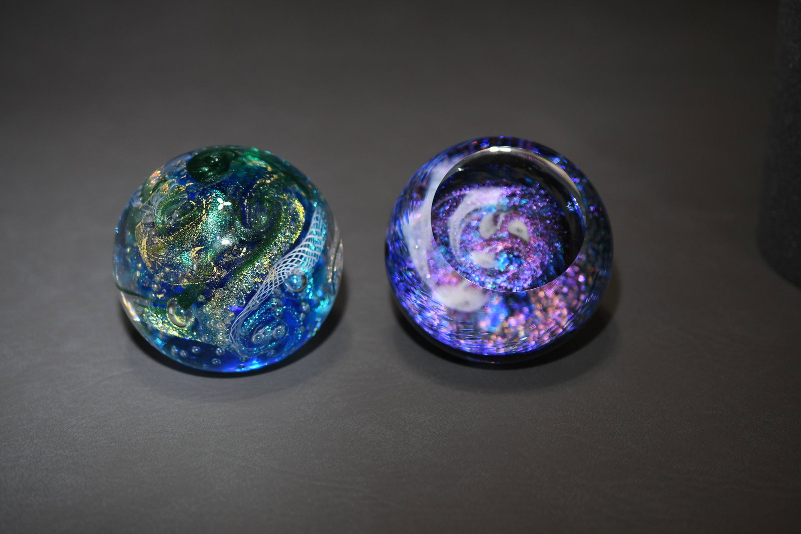 Glass Eye Studio Two Paperweights: "Tropical Storm" and "Whirlpool", 3" high x 3" diameter, approximate total weight 3lb 1oz