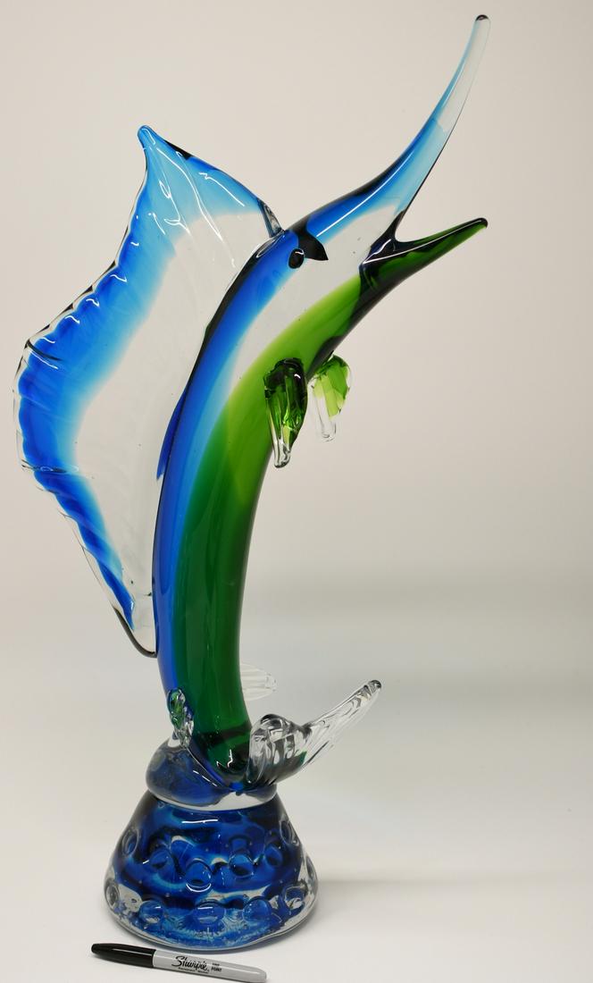 27" Murano Glass Marlin Sculpture: this 26 lb beautiful glass sculpture is 27" tall x about 15" to the widest point of the fin with green, clear & blue glass this is stunning in person. There are no markings that we can find.