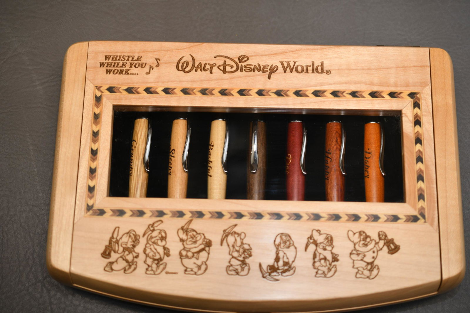 Disney 7 Dwarfs Pen set by Arribas: Walt Disney World "Whistle while you work" Wood pen set inscribed with 7 dwarfs names in wood display case, approximate weight 2lb 8oz