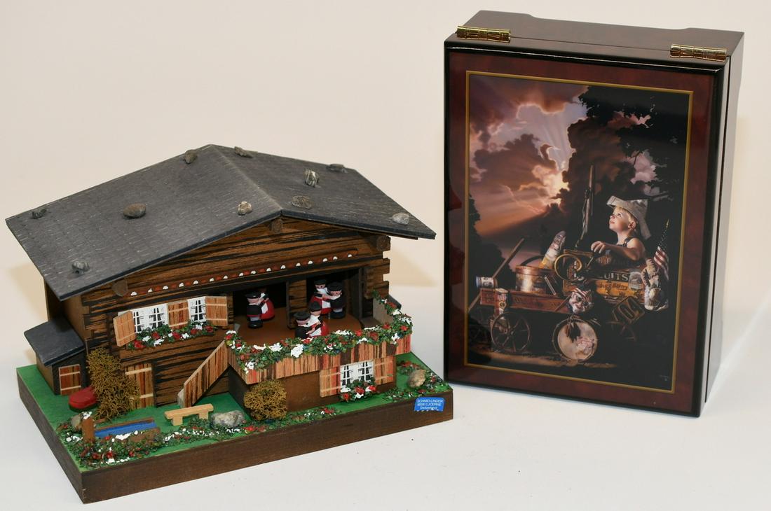 2 music boxes: The first one is a Swiss scene made of wood in great condition except the music doesn't work, and measures 8-1/2" x 5-1/5" x 5-3/8". The second is made by the San Francisco Music Box Company, and is i