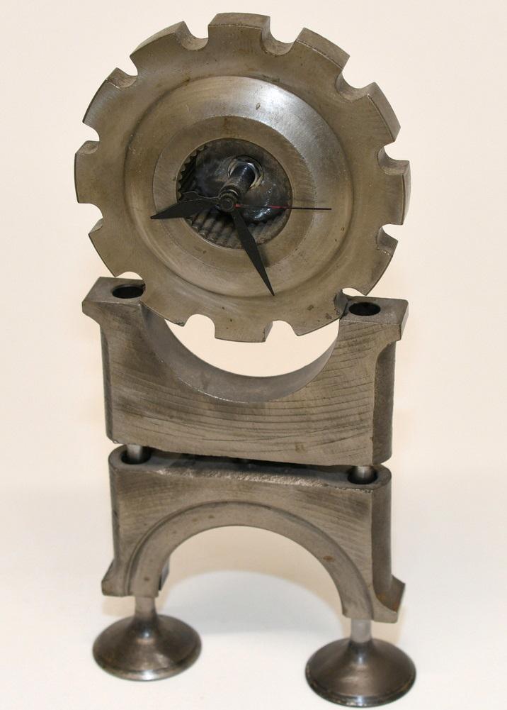 Industrial Metal Clock Sculpture: Quartz clock works, on all iron body measures 10-3/8" x 5", and weighs 5 lbs