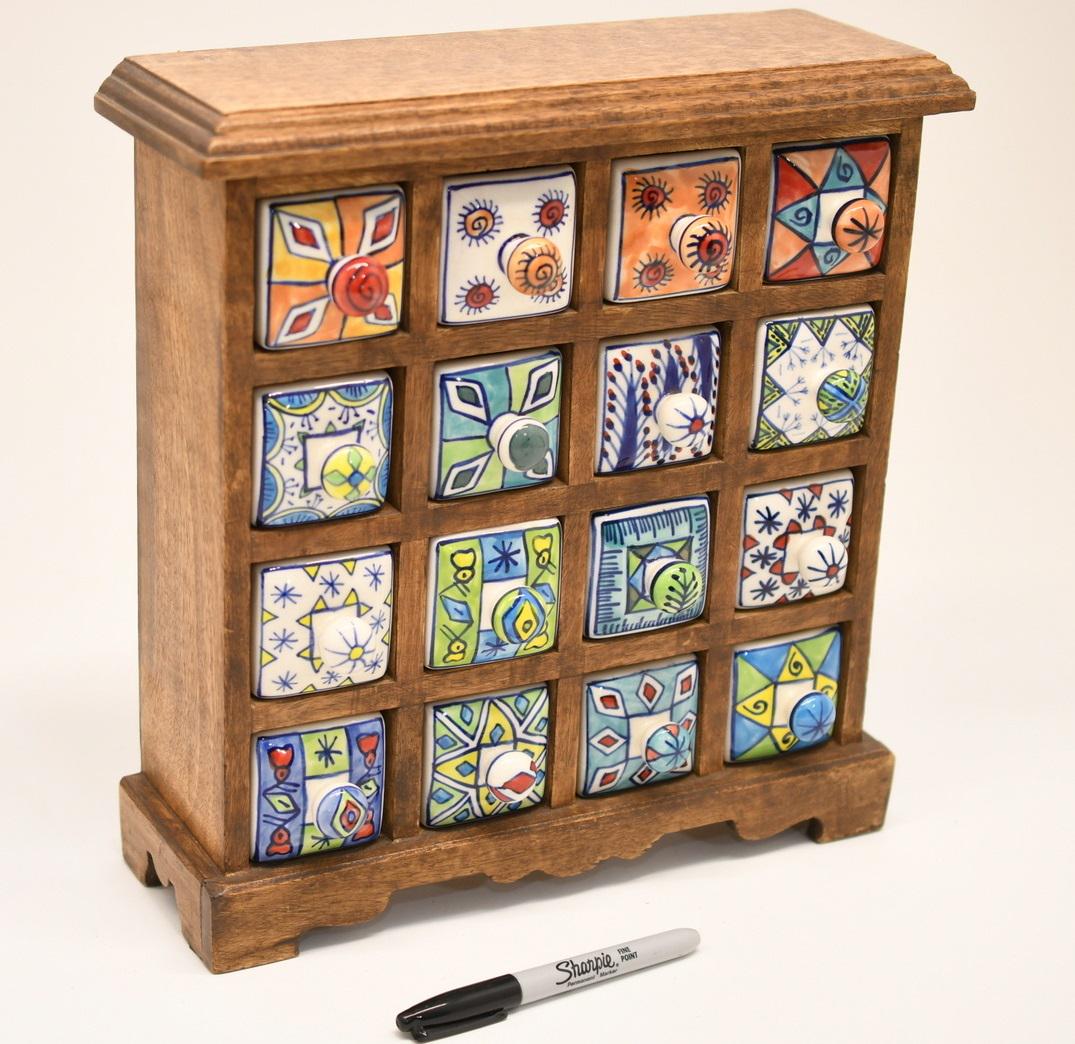 16 drawer curio: Made for Wellspring Gifts the Porcelain drawers measure 3-1/2" long x 2-1/16" plus the knob, the wood cabinet is 13"x 12-1/2"x 4-1/4" and weighs 13 lbs 10 oz