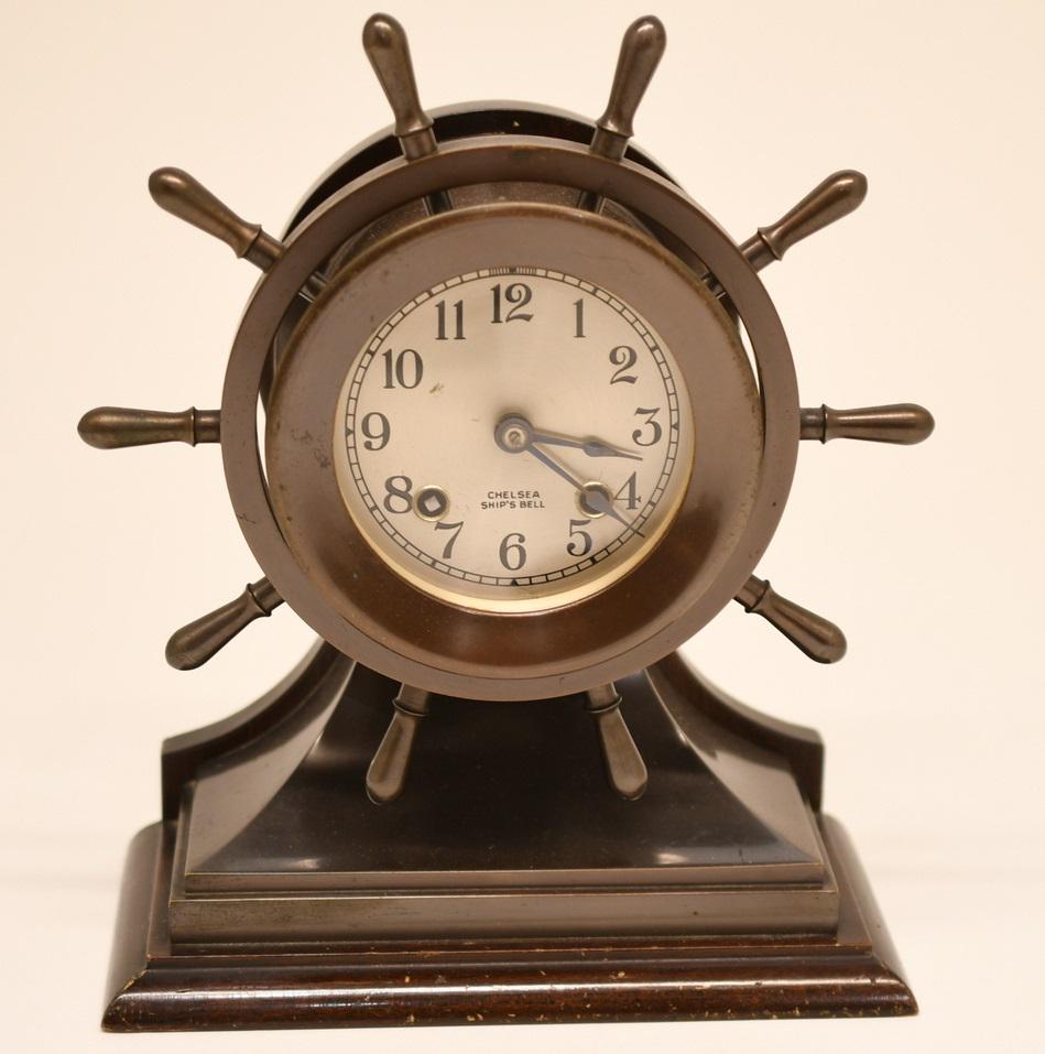 Chelsea Ship's Bell Clock: Serial number stamped into the bottom of the mahogany wood base is 235254. The dimensions are 10" tall x 8-1/4" wide x 4" deep, the clock dial is 4" dia, weight is 9 lbs 3 oz