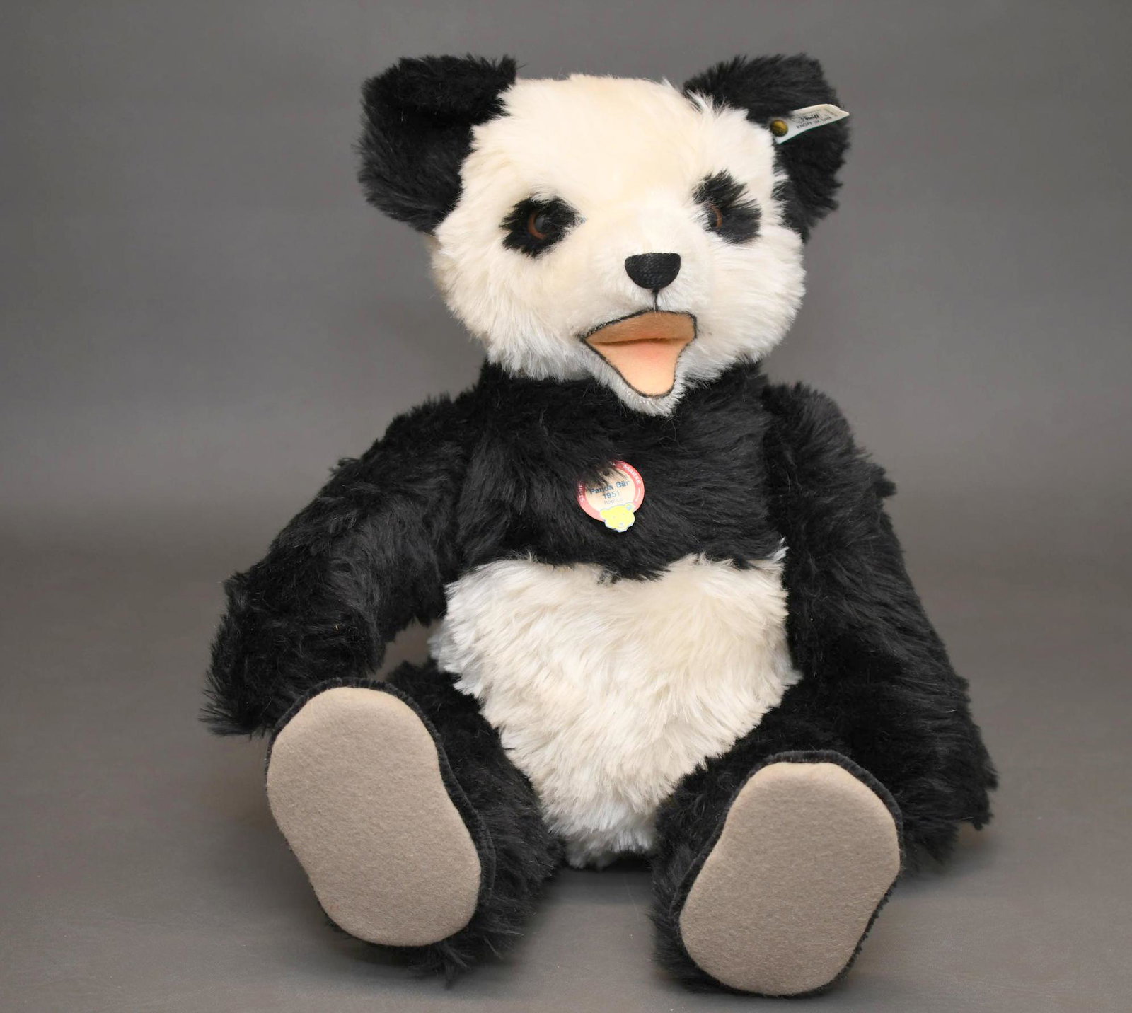 Steiff Panda Bear: 957/3000 is a 1951 Replica and has a sound box he is 18" and weighs 3 lbs 3 oz
