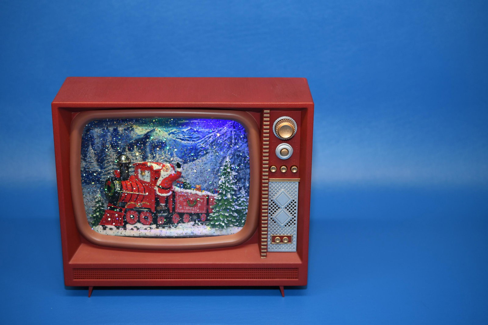 Santa Express Music Box: RAZ Imports Inc. Plastic housing, plays 8 songs, requires 3 C batteries, Fluid filled snow globe effect with variable volume and lights, 8-1/4" tall x 9-3/4" wide x 3-1/2" deep, approximate weight 7lb