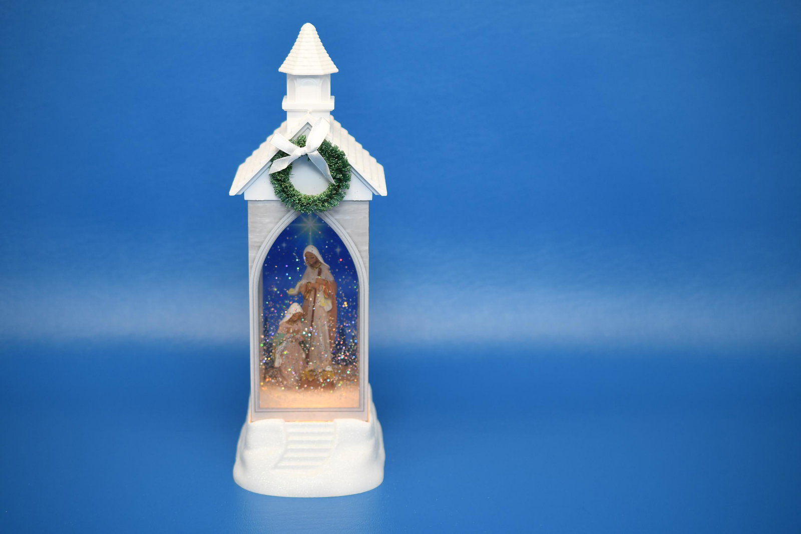 Powered snow Globe Nativity Scene: RAZ Imports Inc., requires 3 AA batteries, windows on 3 sides, rear window translucent, switch actives light and circulation slow no light, stop, and fast with light, 12" tall x 4" wide x 5" deep, app