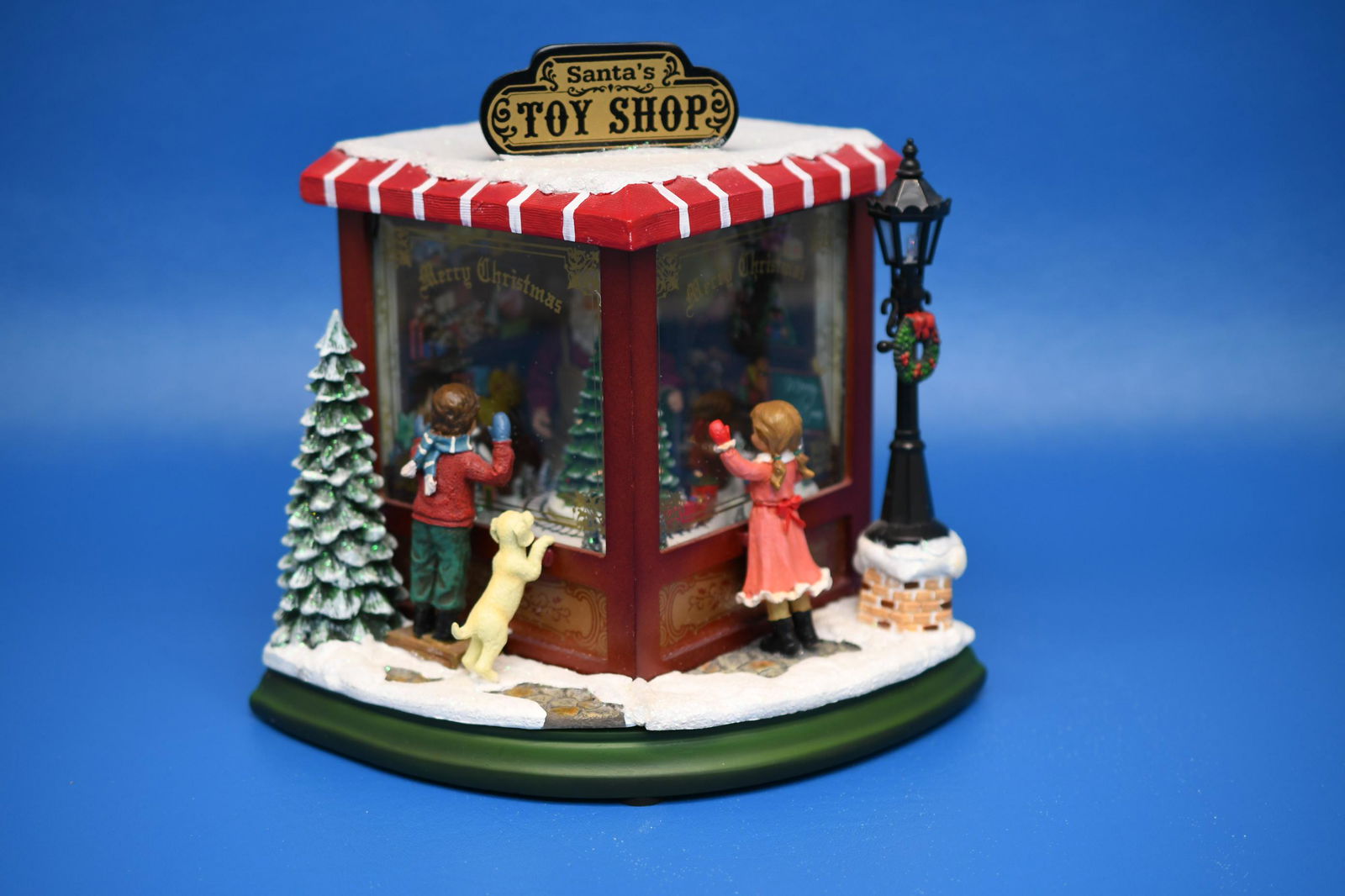 9" Animated Music Box: RAZ Imports Inc. Santa's Toy shop, Requires 3 AAA Batteries, lights blink with music, 8-1/2" tall x 9" wide, approximate weight 3lb 5oz