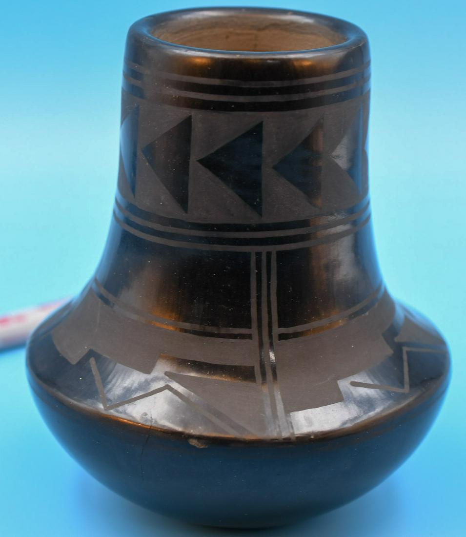 San Ildefonso pottery, Jar, Black on Black, Carmelita Dunlop: 5-1/2 inches tall with 4-3/4 inch diameter. Hand coiled