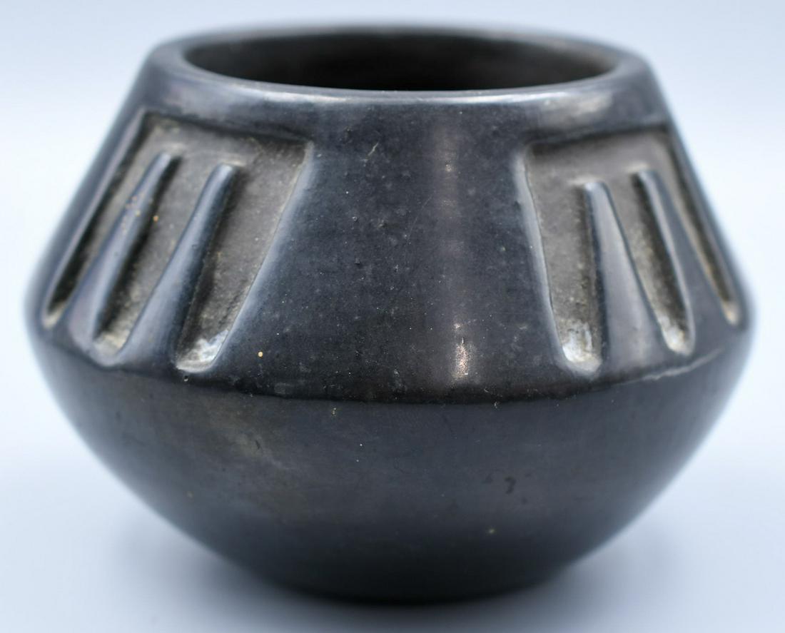 San Ildefonso pottery, Jar, Carved Black, Juanita (Gonzalez?): 3-1/2 inches tall with 5 inch diameter. Hand coiled