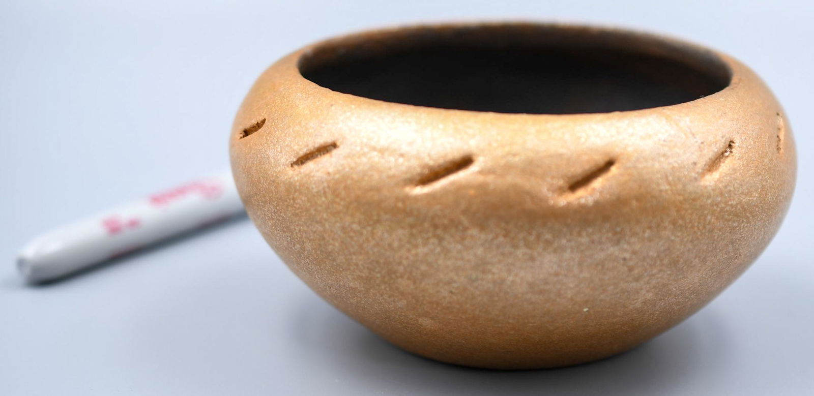 Micaceous Bowl, A. D. Picuris: 2-3/8 inches tall with 4-3/4 inch diameter. Hand coiled