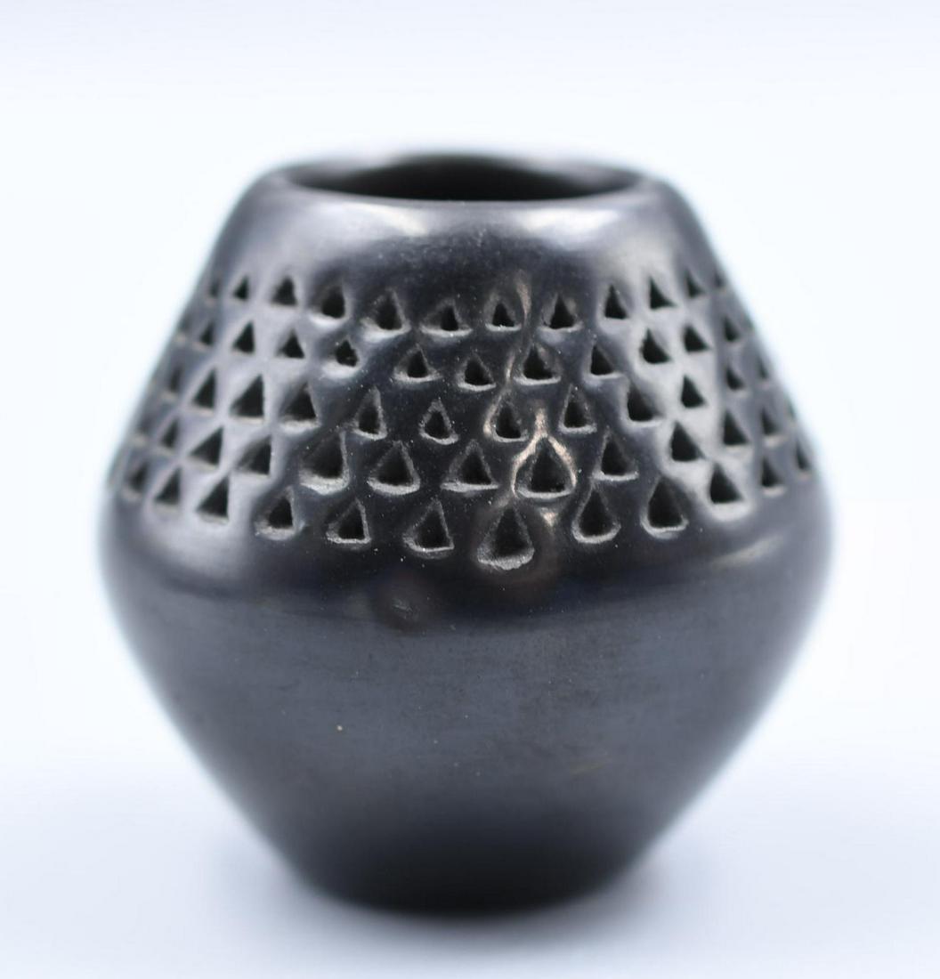 Pojoaque, Small Jar, Black with Triangle Impressions, Lucy Year Flower: 2-1/8 inches tall with 2-1/4 inch diameter