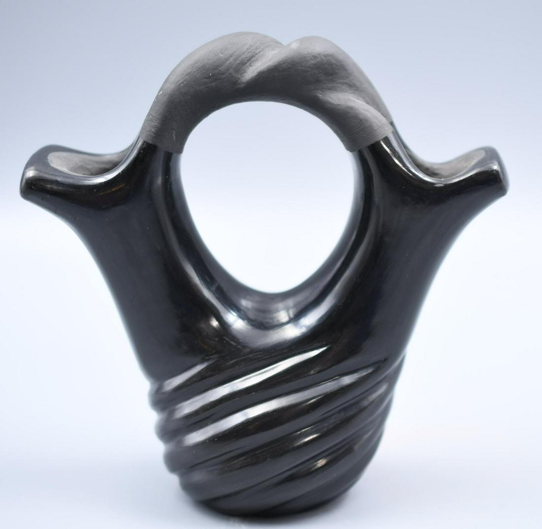 Santa Clara Pueblo, Black Wedding Vase with Carved Swirl and Braided Handle, Polly Marie Vineflower: 5-1/2 inches tall by 5-1/2 inches by 2-1/2 inches