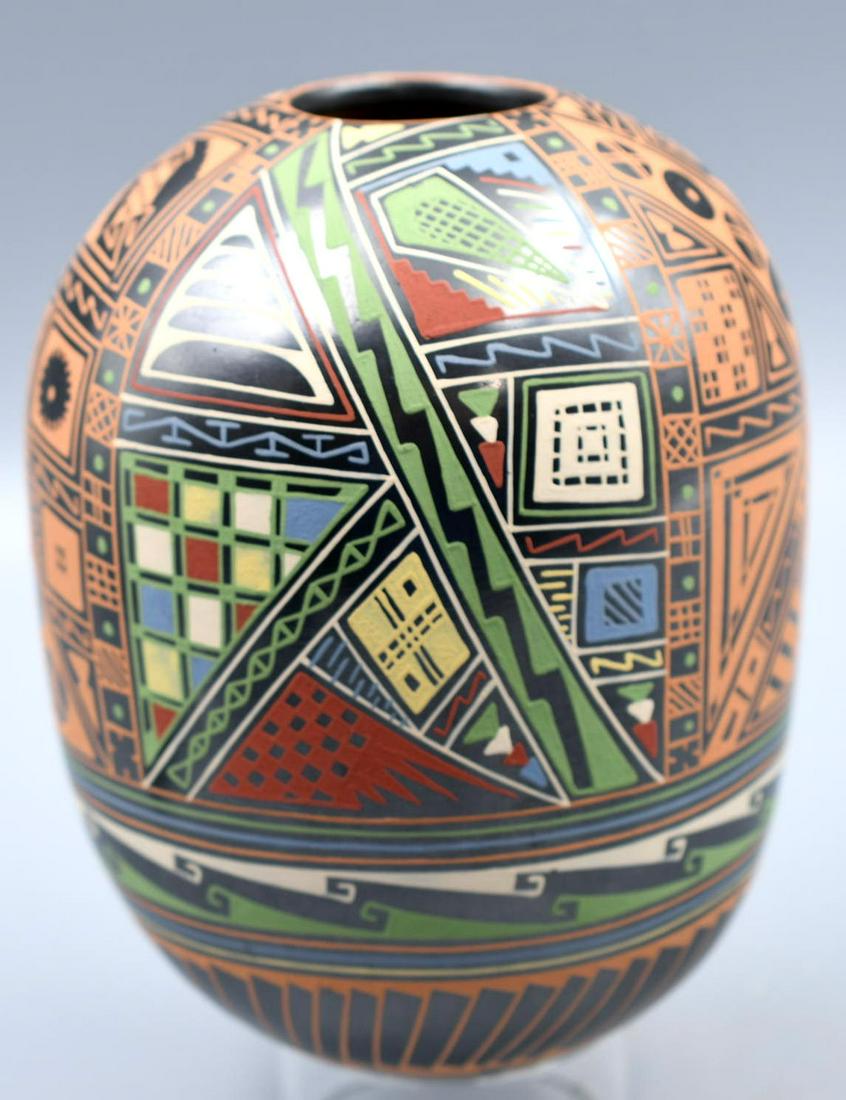 Jar, Polychrome, Complex Geometric Design on Burnished Black Jar, Isidro Ortiz: 5-1/2 inches tall with 4 inch diameter